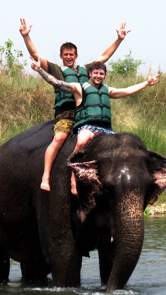 Jungle Safari in Chitwan 2 guys at top